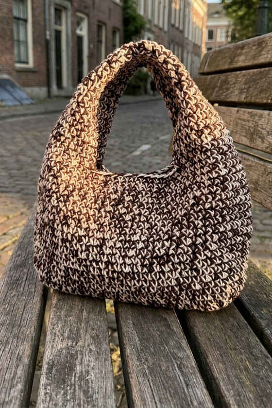 Melert carla loop bag i brun - Strikkia 2026-027-408407