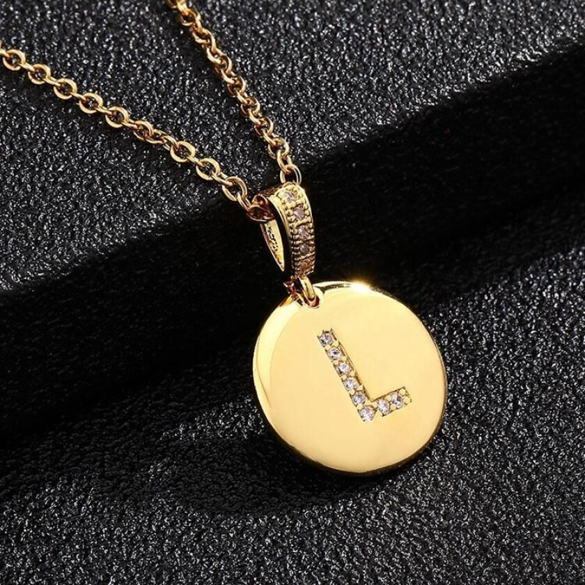 Round letter amulets in gold and zircon gold-plated necklaces