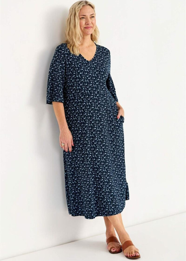 Jersey-kjole med et blomstermønster og lommer